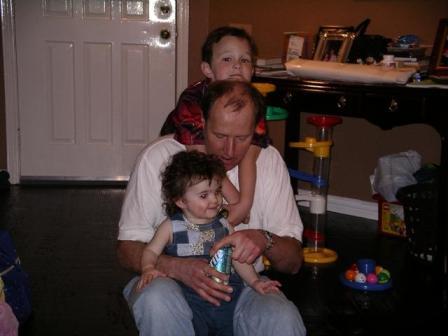 Kevin and Kelsi hanging on Uncle . . . the usual picture.