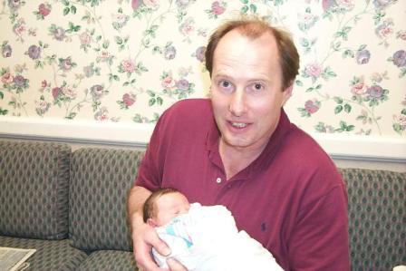 Uncle and Kelsi . . . the day after she was born.