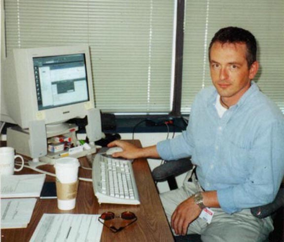 Dan at work with his Starbucks