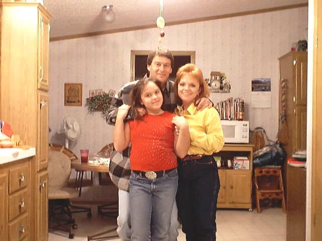 Tonya with husband Mike and daughter Megan