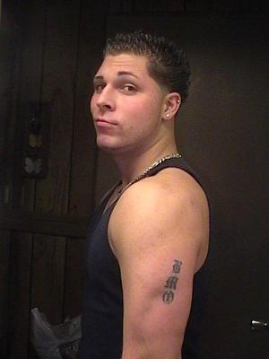 Showing off his tattoo