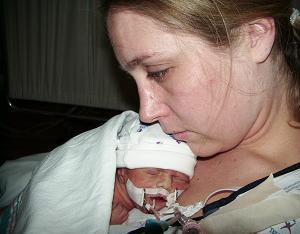 Alexander being held for the 1st time by Mommy.